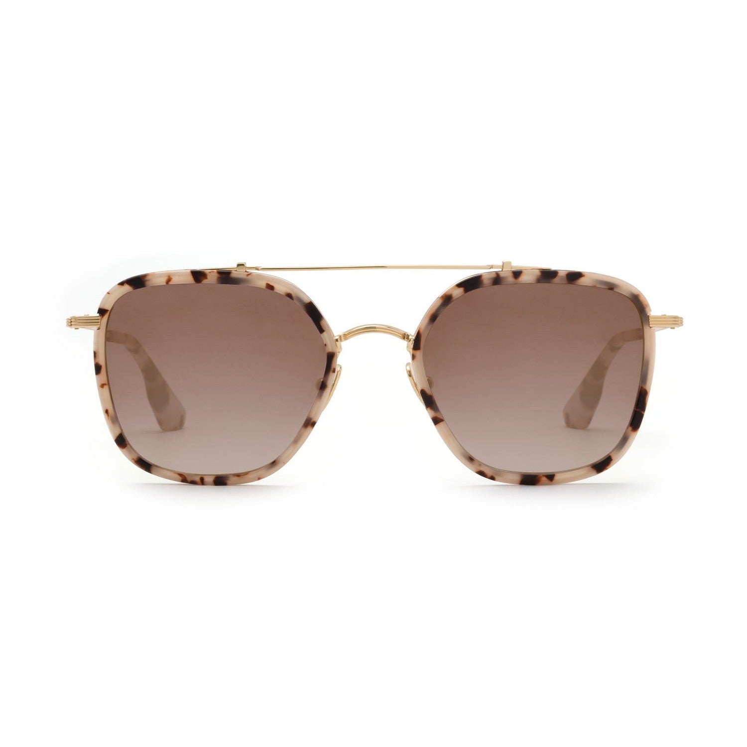 Pair of sunglasses featuring large hexagonal light beige tortoise shell frames with a gold-tone double bridge and temples and brown gradient tinted lenses on a clean white background