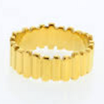 Yellow gold ring featuring a distinctive reeded or fluted texture all around its perimeter