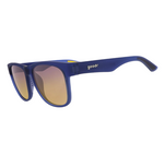 Product photography of goodr sunglasses with matte blue frames yellow-orange gradient lenses and subtle yellow temple accents