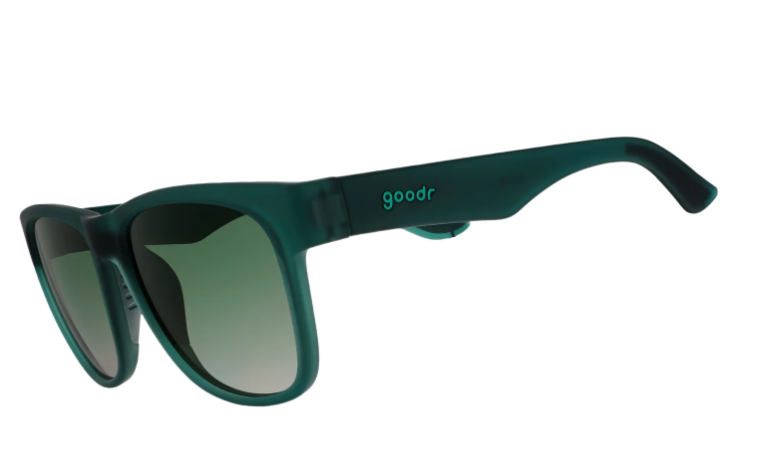 Goodr sunglasses with a matte dark green frame, gradient dark green lenses, and a lighter teal goodr logo on the temple