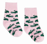 Textile, Lacoste pair of pink socks with a repeating green crocodile logo pattern and ribbed cuffs