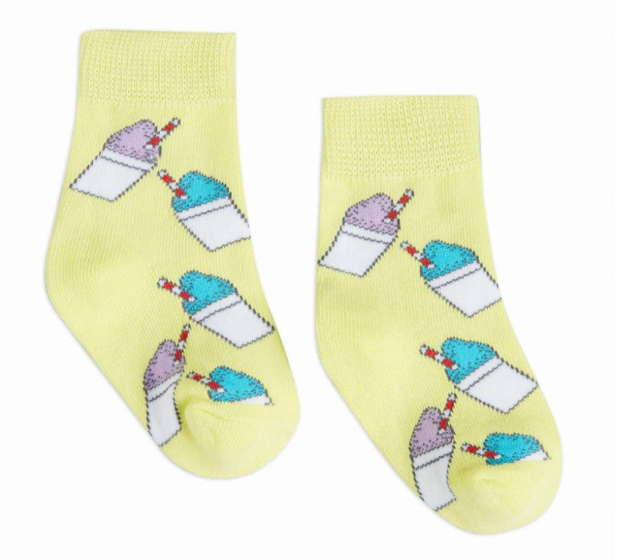 Pair of bright yellow ankle socks featuring a repeating pattern of cartoon purple and blue snow cones with red and white striped straws