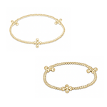 Two identical yellow gold beaded bracelets featuring four evenly spaced round bead clusters