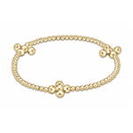 Gold beaded bracelet featuring numerous polished yellow gold spheres and three larger four-bead clover-like clusters evenly spaced along the elegant band
