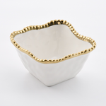 A white square ceramic bowl with an organic textured exterior, smooth off-white interior, and a gold beaded scalloped rim on a white background