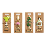 Four cocktail themed metal bottle openers on cardboard backing