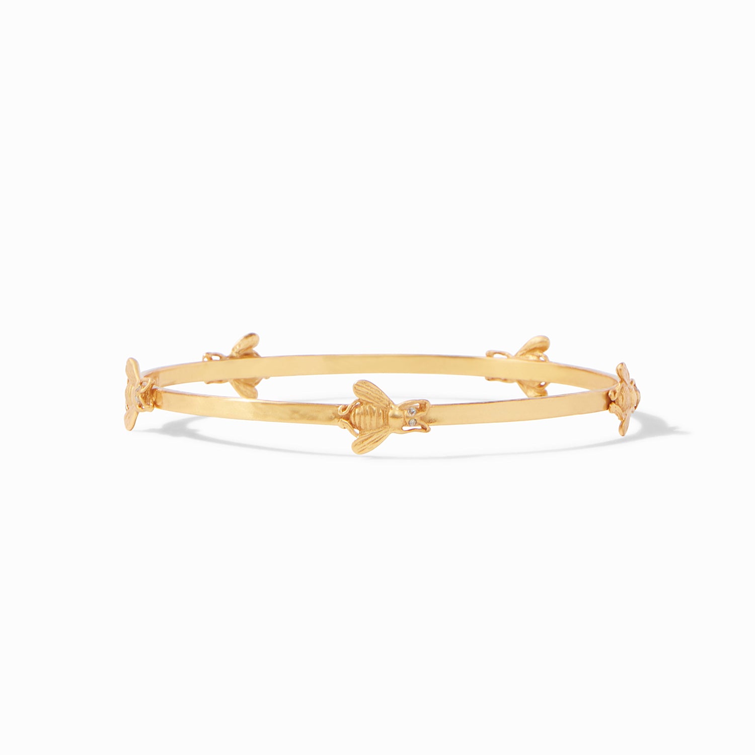 Gold bangle bracelet featuring small bee motifs