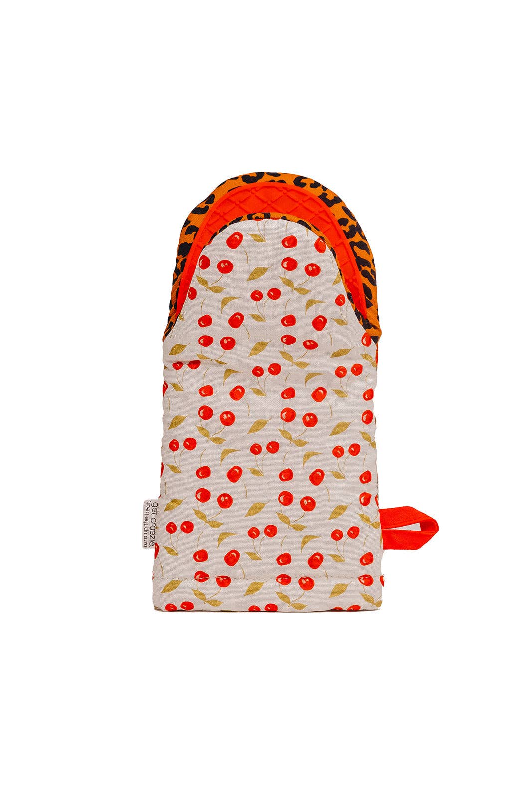 Product photo, Get Crazie oven mitt in cream fabric with a vibrant red cherry and gold leaf pattern, revealing an orange leopard print lining and a bright orange hanging loop with a small "get crazie" tag