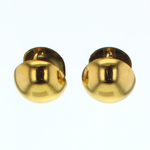 Jewelry: a pair of polished yellow gold domed stud earrings with brilliant reflective surfaces