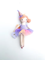 Photograph of a Mud Pie brand ballerina rag doll on a white background wearing a glittery pink party hat a vibrant purple pink and peach tulle tutu skirt and sparkly pink ballet slippers holding a Holly the Birthday Bestie tag