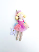 Mudpie plush toy Dottie the Birthday Bestie ballerina doll with blonde pigtails, a pink sparkly leotard, a vibrant rainbow tulle tutu, and gold ballet slippers, accompanied by its product tag