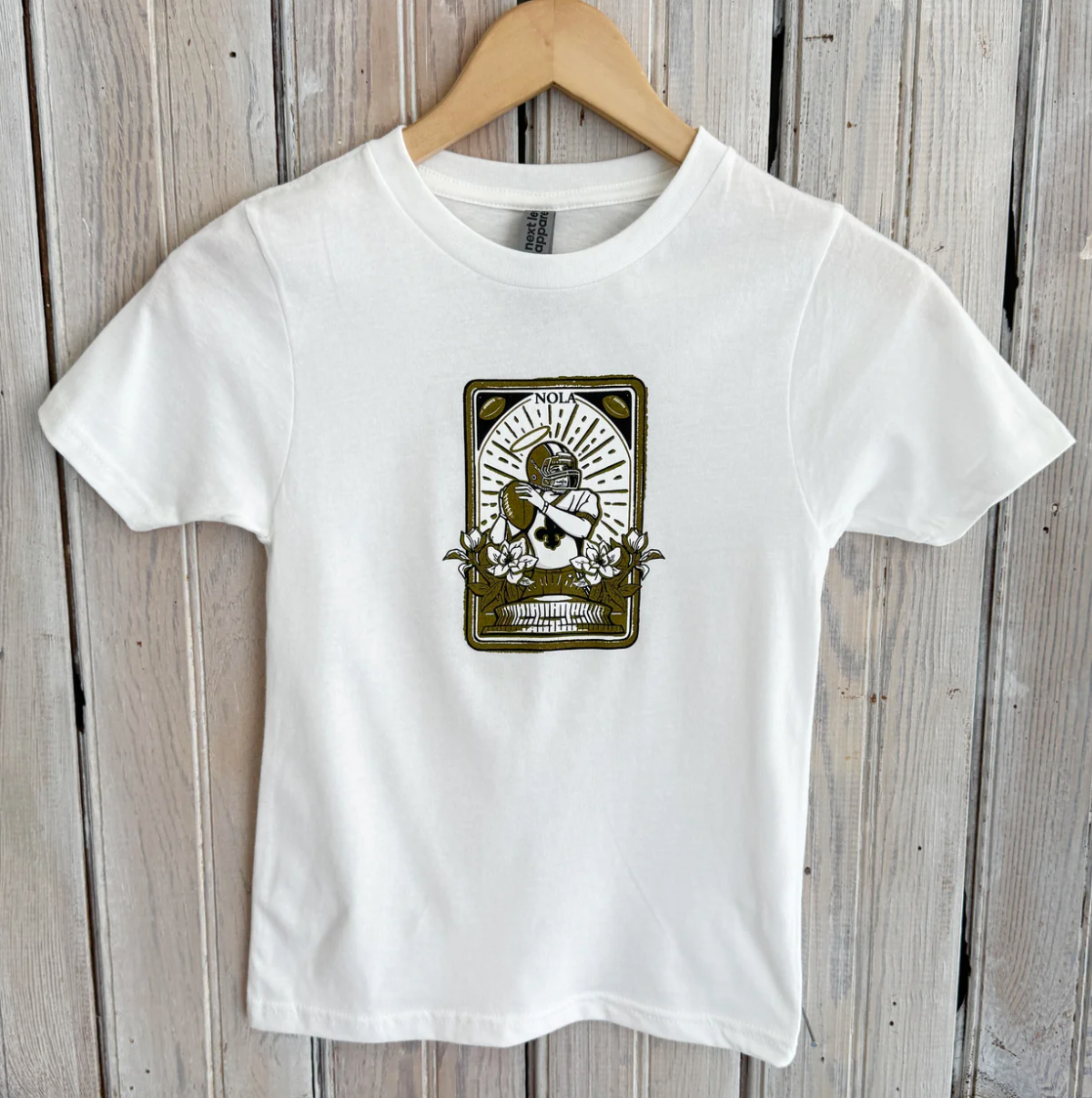 White t-shirt with a NOLA football player graphic featuring a halo and flowers