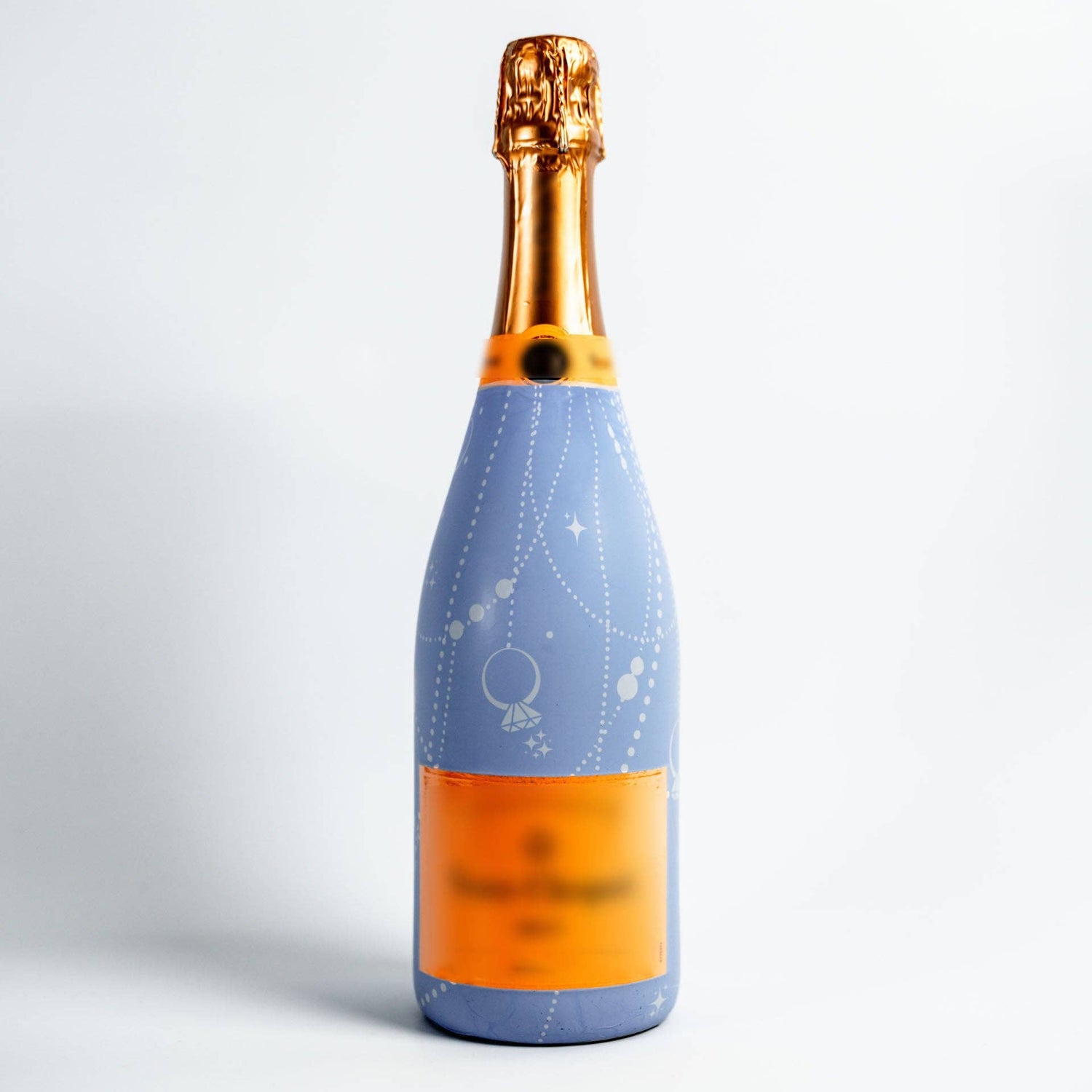 Bottle with a blue label and gold cap on a white background