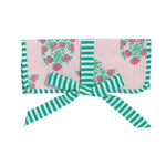 Quilted light pink folding case featuring a repeating fuchsia rose and green leaf pattern, bordered and tied with a vibrant teal and white striped ribbon bow