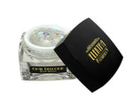 Product photo by Elektra Cosmetics of an open clear jar of Opal Unicorn Bolt Balm featuring iridescent chunky glitter and a black lid with a gold logo