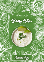 Bowl of creamy cilantro lime dip garnished with lime wedges and cilantro on a green background with vegetable sketches