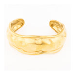 Gold cuff bracelet with a hammered texture