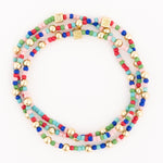 Three beaded bracelets featuring rows of small colorful seed beads in red, pink, blue, green, and aqua, accented with shiny gold round beads and unique square gold beads with an etched pattern, displayed in a loose circular arrangement on a white studio background