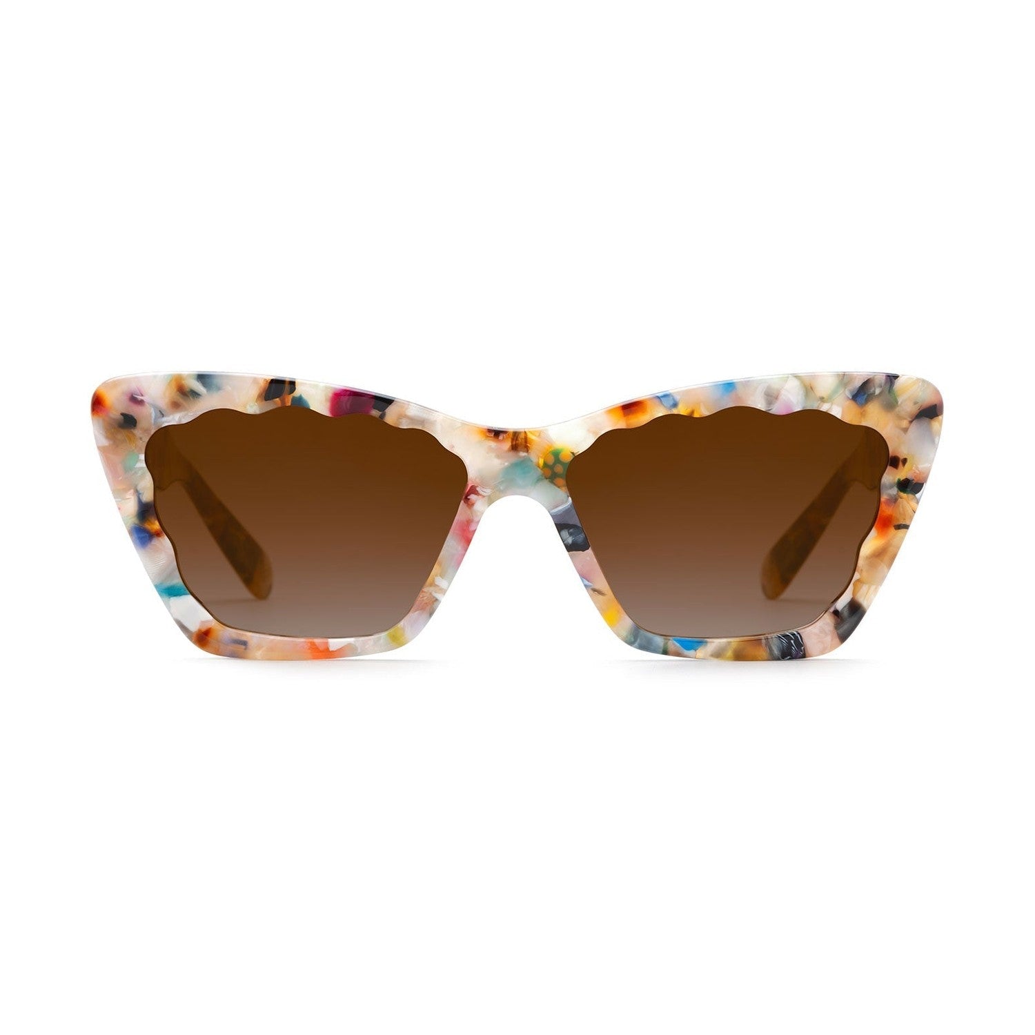 Product photo of cat-eye sunglasses on a white background featuring a multicolor terrazzo-like acetate frame, scalloped top edge, and brown gradient lenses