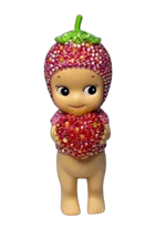 Sonny Angel figurine wearing a strawberry hat and holding a crystal strawberry