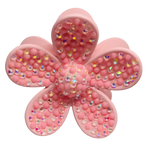 Pink flower shaped hair claw clip with embedded iridescent rhinestones