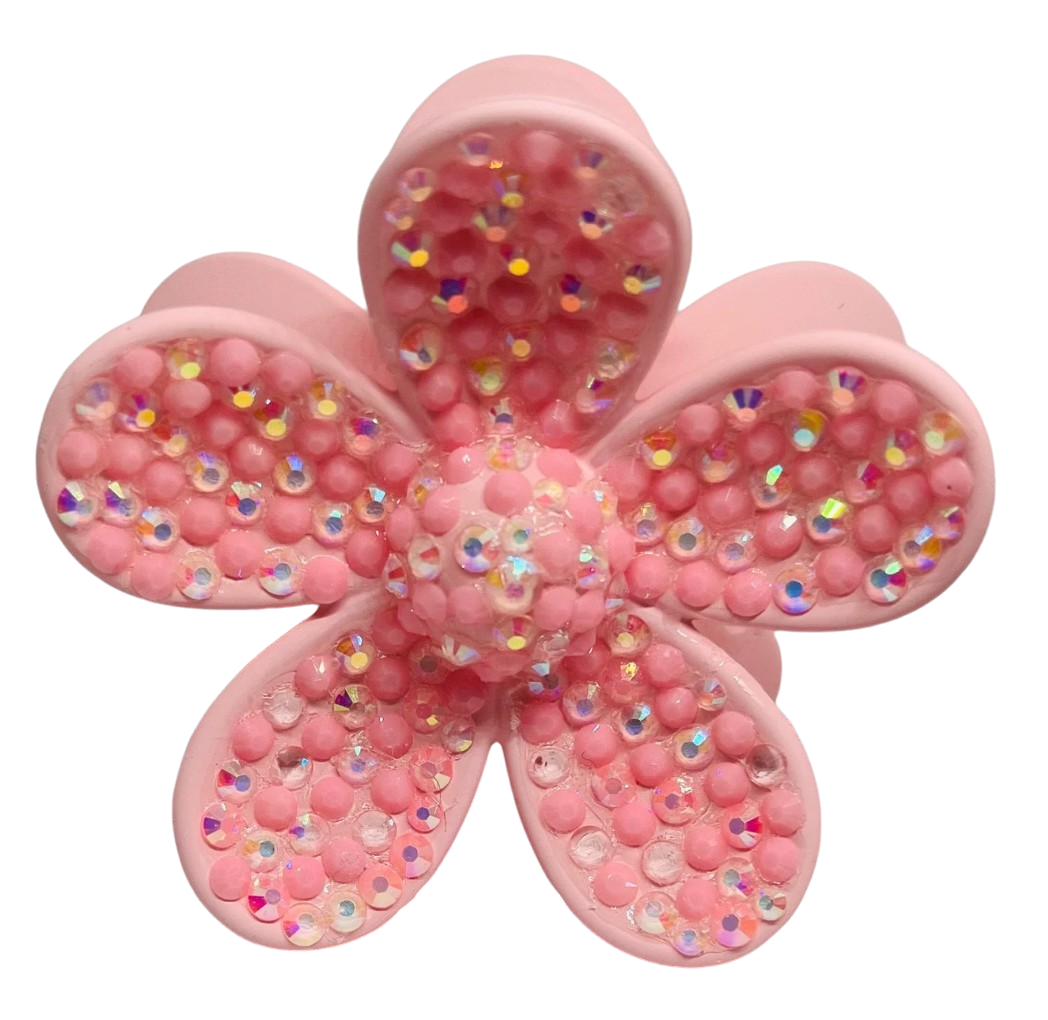 Pink flower shaped hair claw clip with embedded iridescent rhinestones