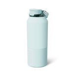 Product photograph of a BRUMATE mint green insulated water bottle featuring a flip-top lid with a clear section and vertically embossed BRUMATE logo