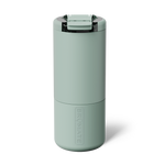 A sage green BrüMate insulated travel mug with a secure flip-top lid and vertically embossed branding