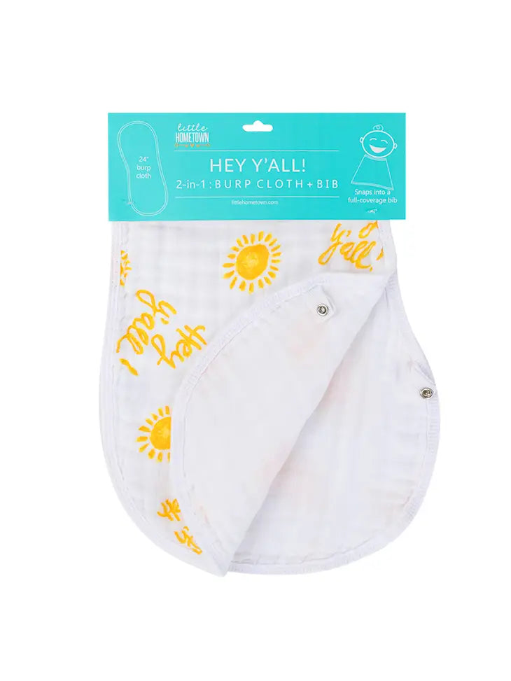 Little Hometown 2-in-1 burp cloth and bib in teal packaging featuring white fabric with yellow sun graphics and Hey Y'all! text and functional snaps
