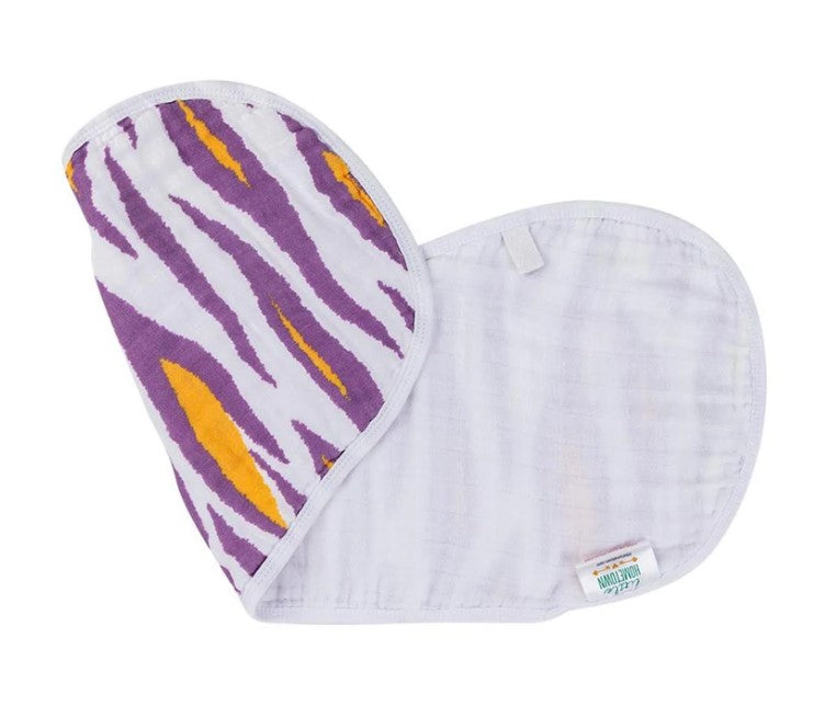 Baby burp cloth featuring a vibrant purple and gold tiger stripe pattern on one side and a soft white muslin reverse with a little HOMETOWN brand tag