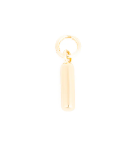 A small gold cylindrical bar charm with a polished finish attached to a circular jump ring on a white background