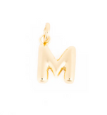 Shiny golden puffy letter M charm with a small hanging bail on a white background