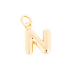 A shiny gold puffy bubble letter N charm with an attached jump ring against a plain white background