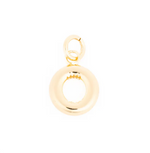 Gold metal jewelry, a polished doughnut-shaped charm with a chunky O-shape and a small spring-ring clasp