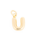 Gold jewelry charm of a polished, rounded letter U with a top jump ring