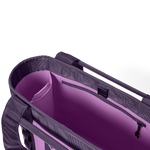 Digital photography of a deep purple tote bag showing its open interior with vibrant lilac lining, multiple organizational pockets, and a zippered compartment