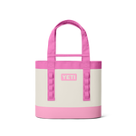 YETI tote bag in white and bright pink featuring a prominent YETI logo, sturdy pink top handles, and vertical side loops