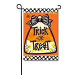 Halloween garden flag featuring a candy corn graphic with a black and white striped bow and Trick or Treat text