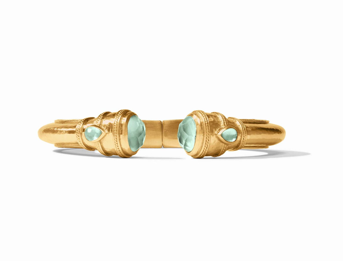 Gold cuff bracelet with two large faceted mint green stones and two smaller teardrop mint green stones