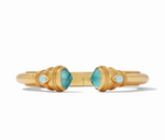 Gold cuff bracelet with two large teal faceted stones and two smaller teardrop teal stones