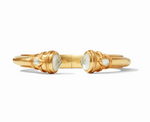 Gold cuff bracelet with two faceted white stone terminals