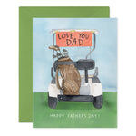 Watercolor illustration of a Father's Day greeting card featuring a white golf cart with a brown golf bag full of clubs, an orange banner on the roof displaying LOVE YOU DAD, and the message HAPPY FATHER'S DAY below, all set on a green golf course against a light blue sky with a green envelope partially visible behind