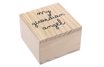 A small light-colored wooden box with visible grain featuring black handwritten-style text "my guardian angel" on its square lid