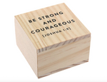 Small wooden box with the text Be Strong and Courageous Joshua 1 9 printed on the lid