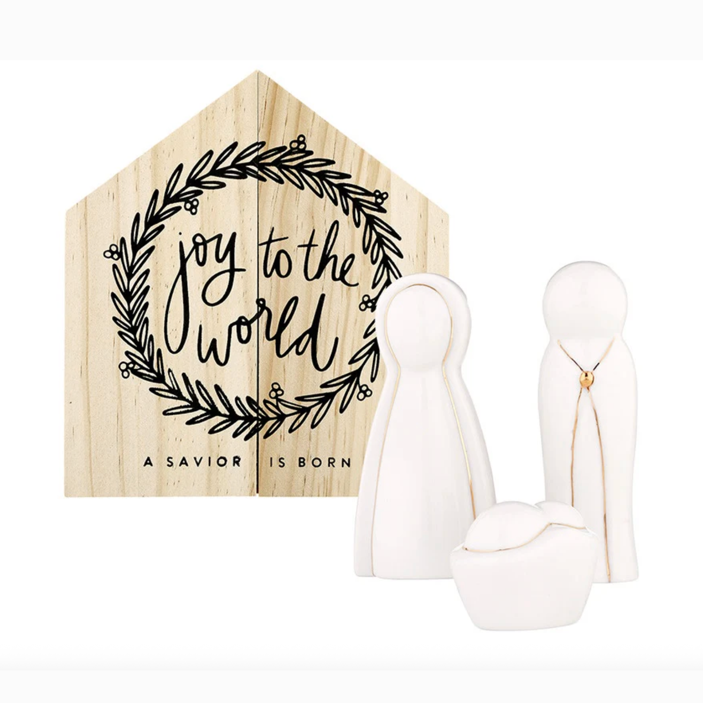 Modern minimalist ceramic and wood nativity set featuring three white stylized figures with delicate gold accents and a light wood house-shaped sign emblazoned with a black 'joy to the world' wreath and 'A SAVIOR IS BORN' text