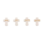 Four cream-colored ceramic cross-shaped tiles arranged in a row featuring embossed gold words LOVE JOY FAITH BLESSED