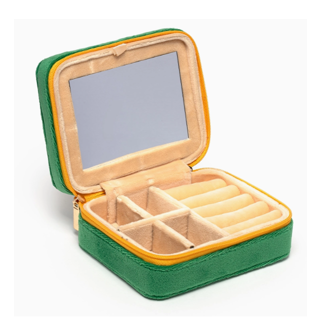 Open green velvet travel jewelry case with mirror and beige interior compartments