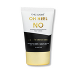 Product photography Chez Gagné OH HEEL NO Intensely Moisturizing Foot Crème tube in a striking white, black, and gold design, highlighting "Sea Salt Citrus Neroli" and ingredients like shea and cocoa butter on a white background