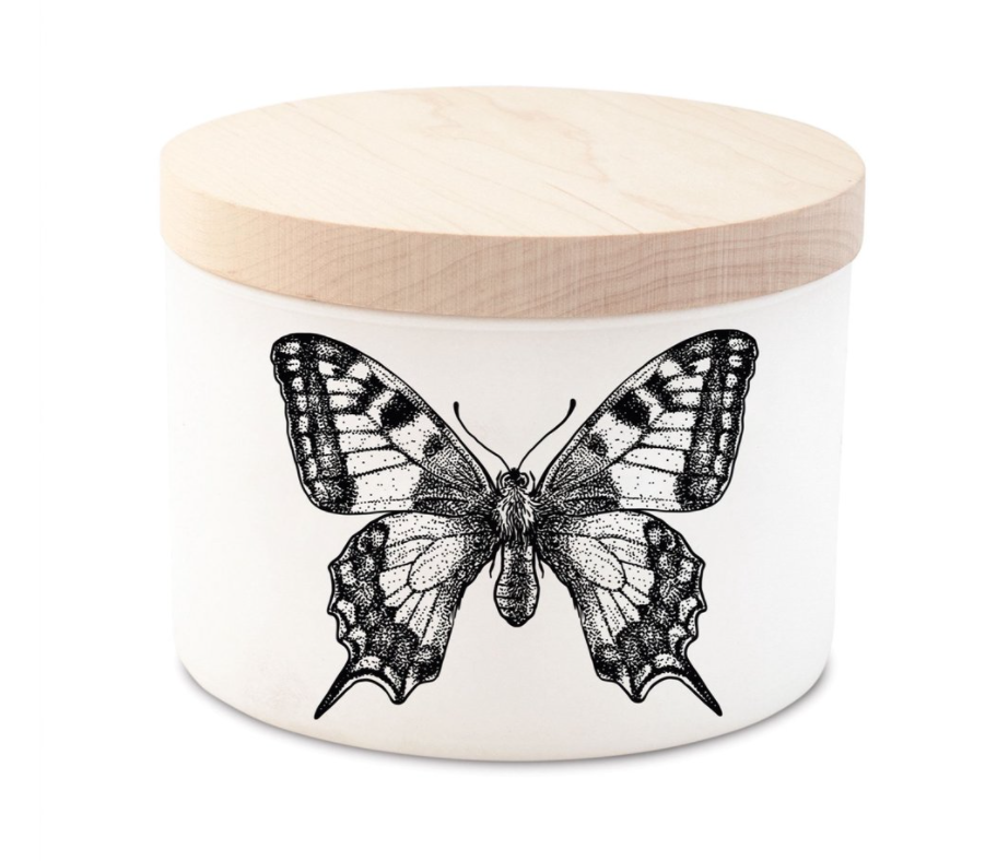 White cylindrical candle jar with a wooden lid and a black ink butterfly illustration