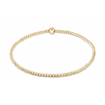 Gold beaded stretch bracelet with a single larger central bead